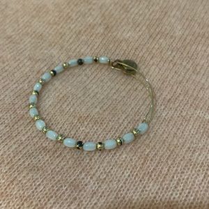 White and gold beaded Alex and Ani